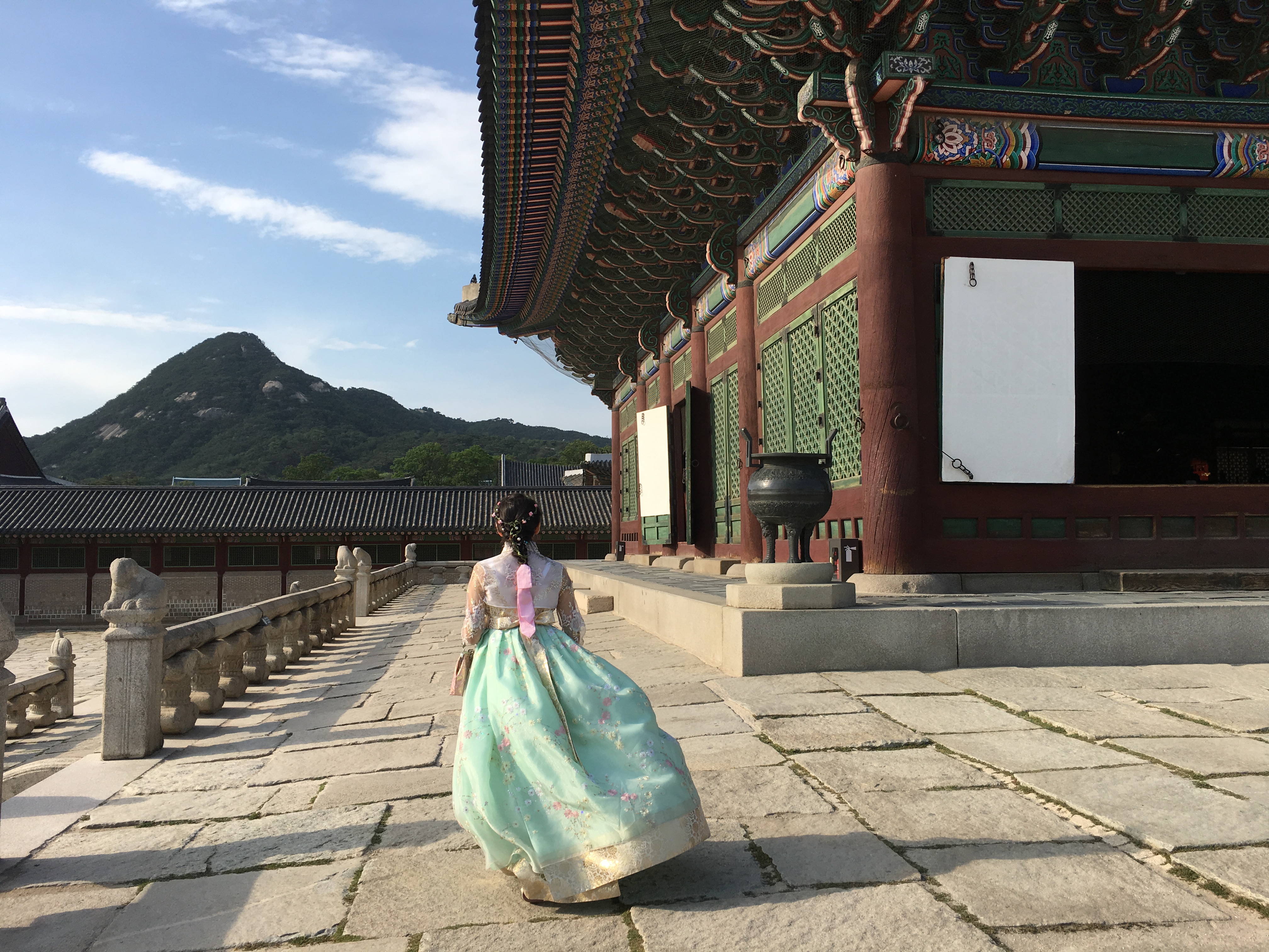 Study Abroad Photo Contest Photo, Student in Korean dress taking a stroll around Gyeongbokgung Palace